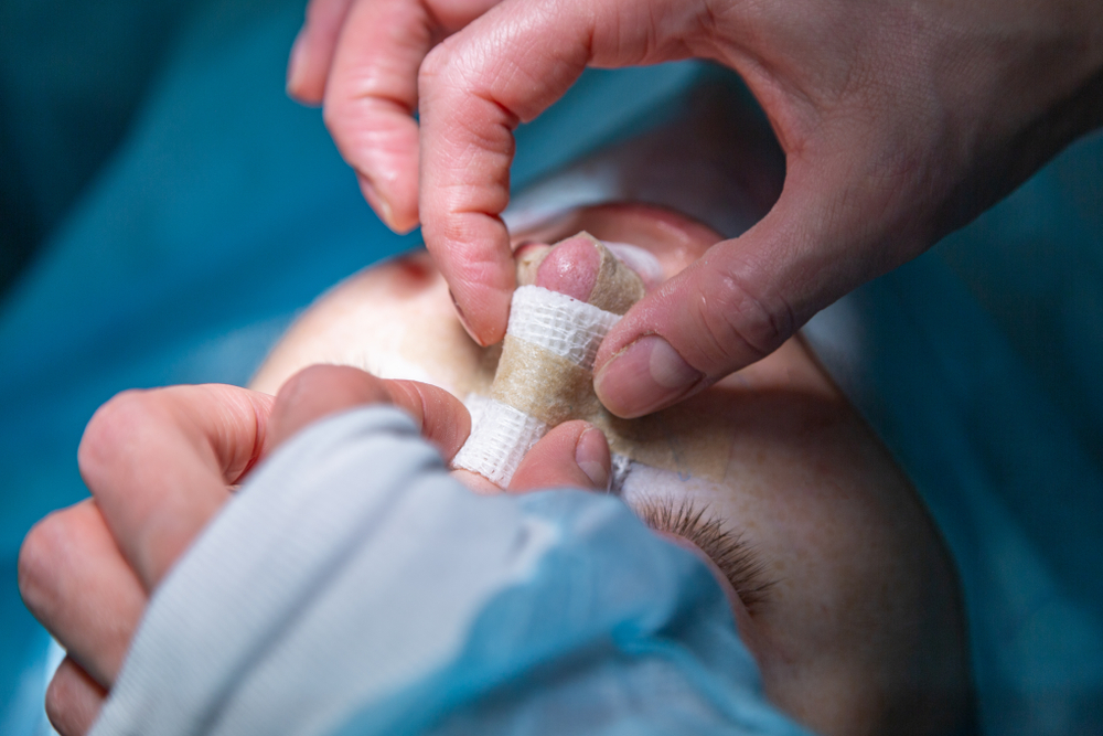 Surgeon,And,His,Assistant,Performing,Cosmetic,Surgery,On,Nose,In